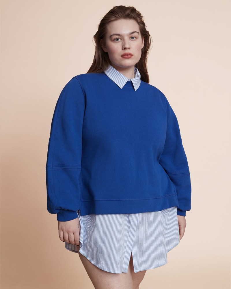 Front of a model wearing a size L Puff Sleeve Sweatshirt in BLUE by GANNI. | dia_product_style_image_id:226921